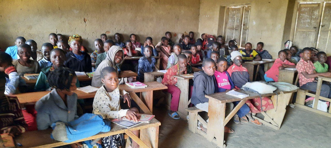 Smiling children holding books